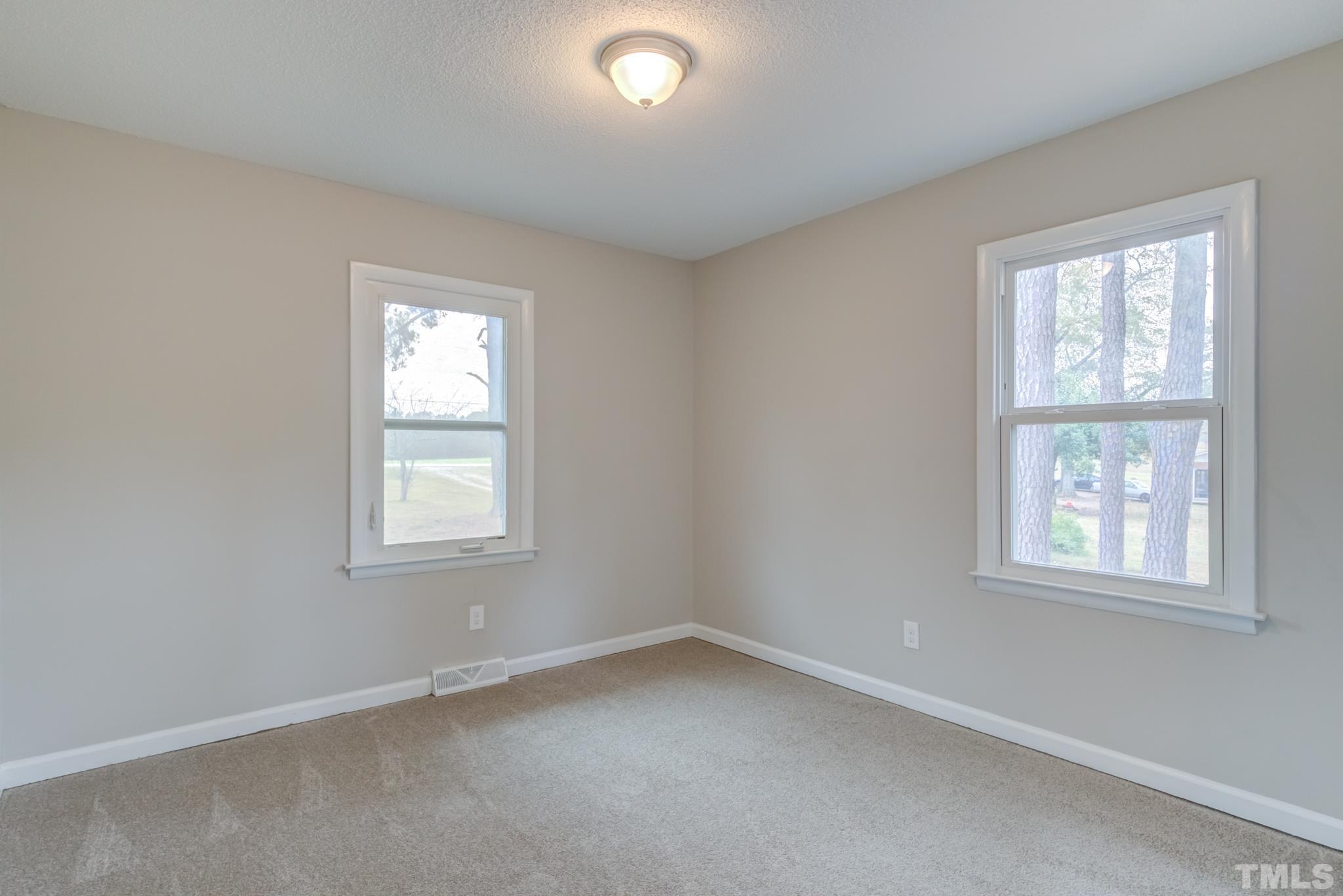 3600 Edgemont Road Wendell, NC 27591 - Photo 22 of 30 an empty room with a window