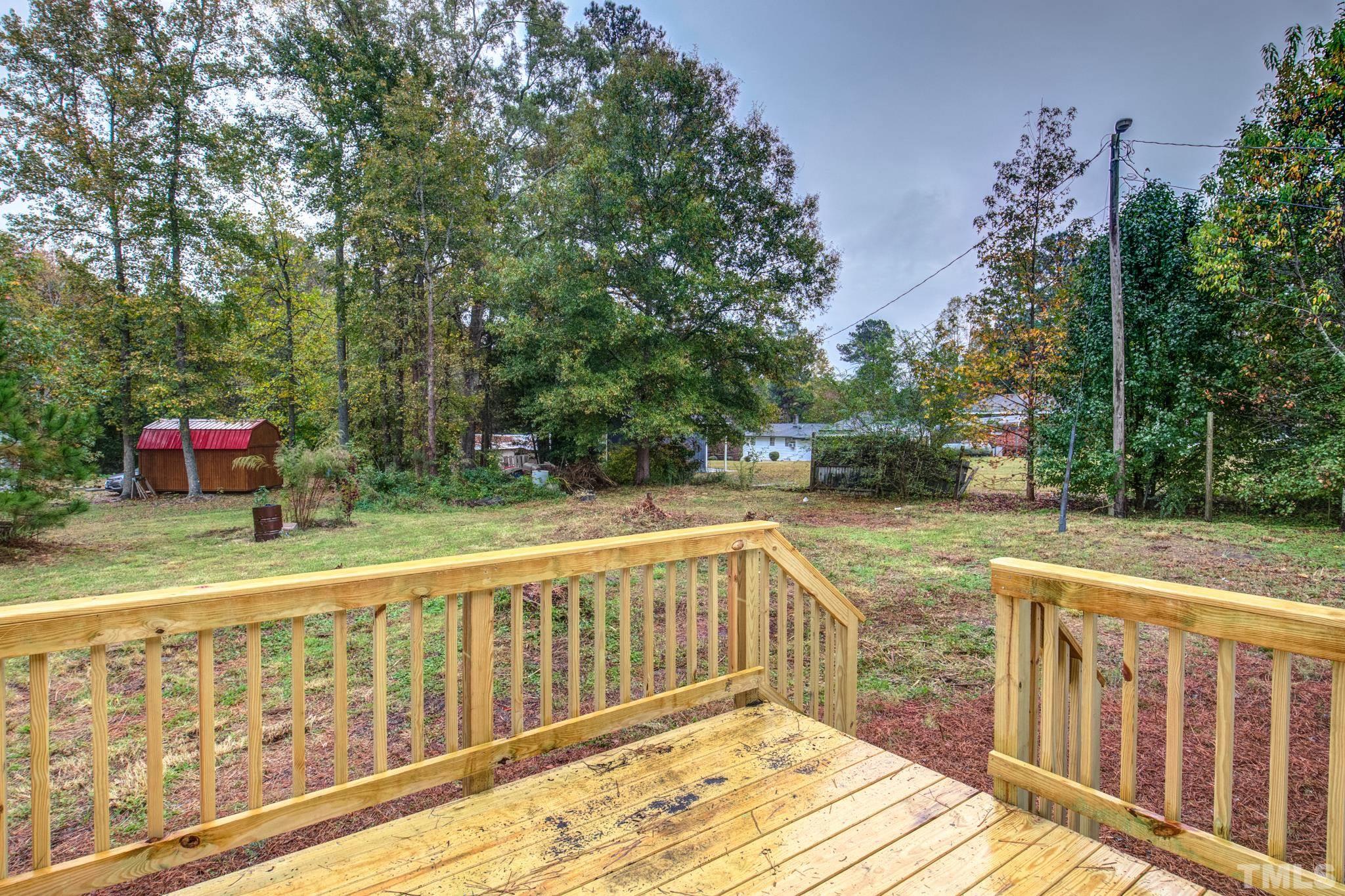 3600 Edgemont Road Wendell, NC 27591 - Photo 29 of 30 a view of a wooden deck with trees