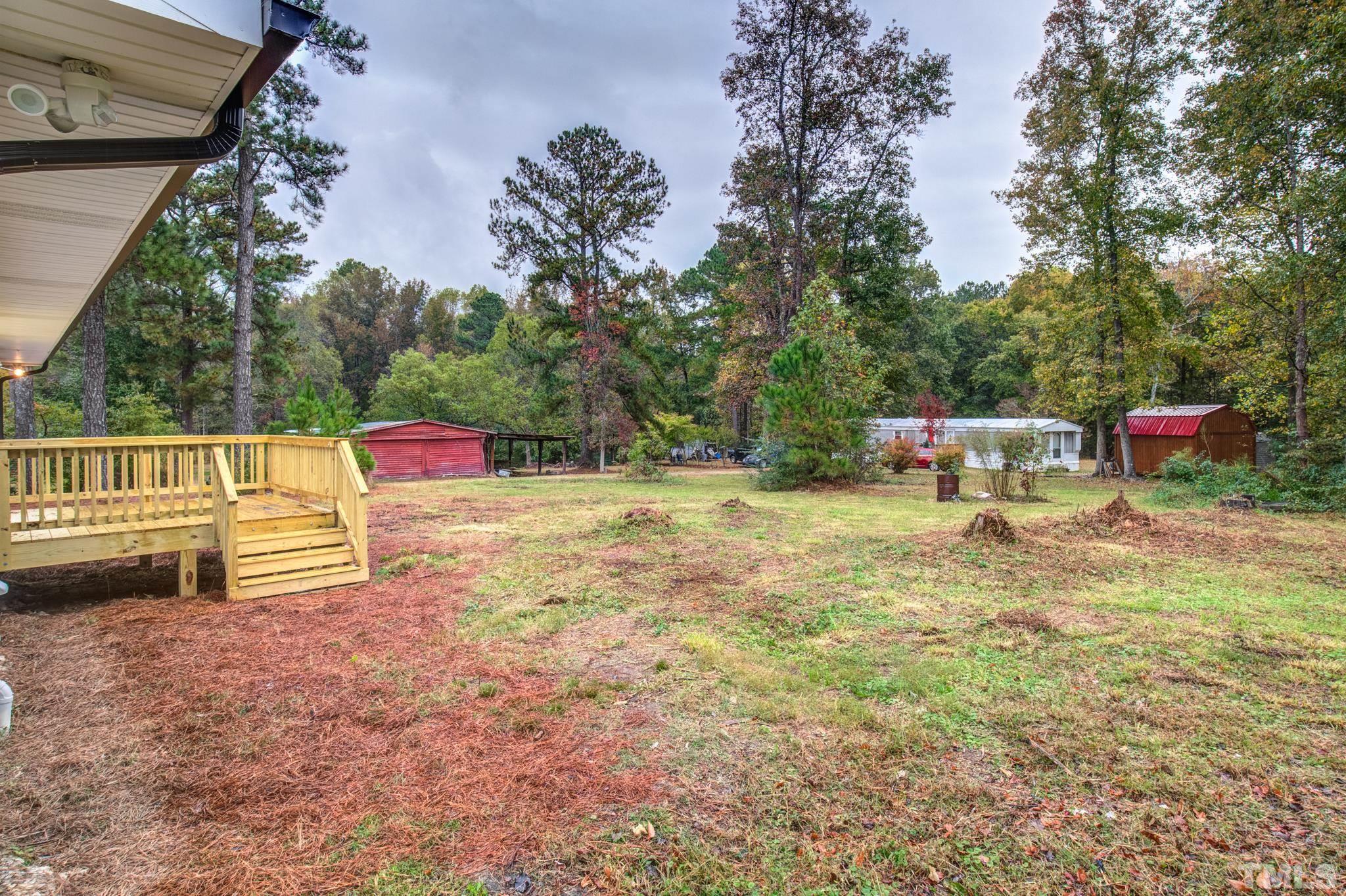 3600 Edgemont Road Wendell, NC 27591 - Photo 30 of 30 a backyard of a house with table and chairs