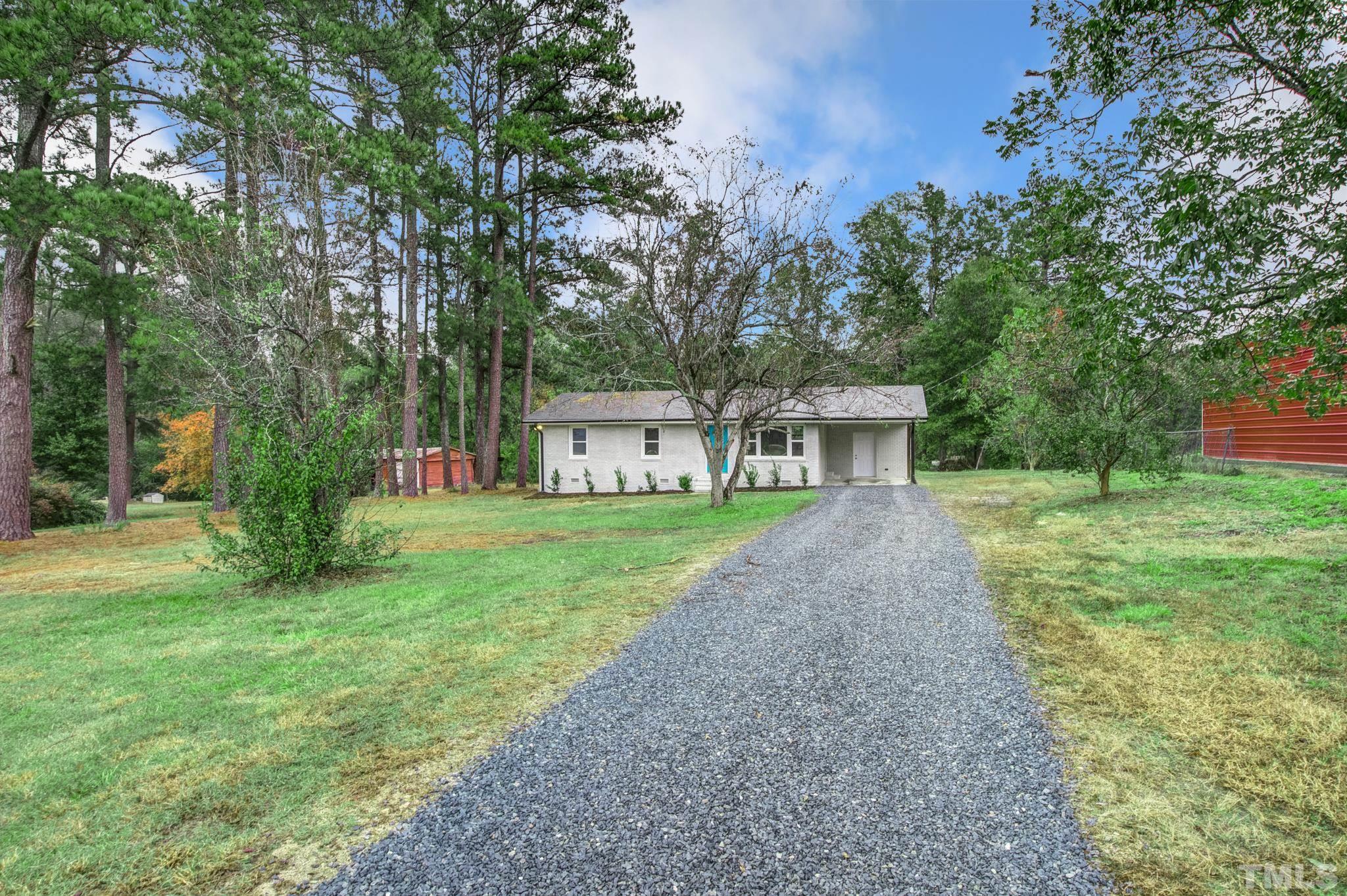 3600 Edgemont Road Wendell, NC 27591 - Photo 4 of 30 a view of a house with backyard and a sitting area
