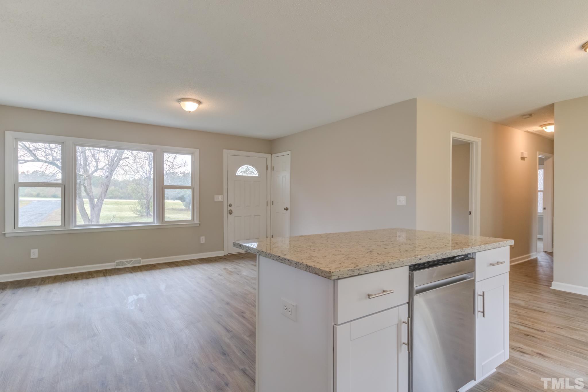 3600 Edgemont Road Wendell, NC 27591 - Photo 9 of 30 an empty room with wooden floor and window