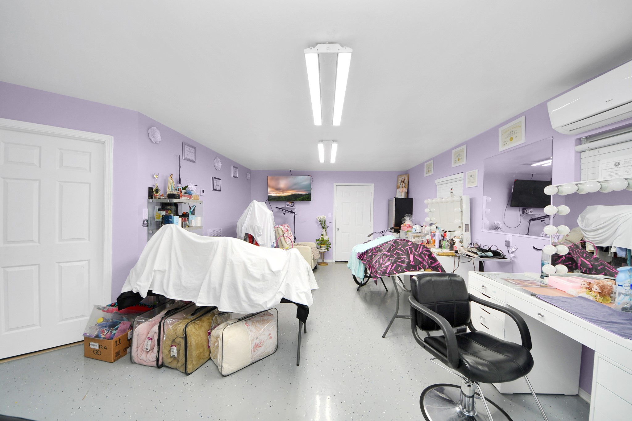 5319 Avenue R Galveston, TX 77551 - Photo 13 of 20 a bed room with furniture and a chandelier