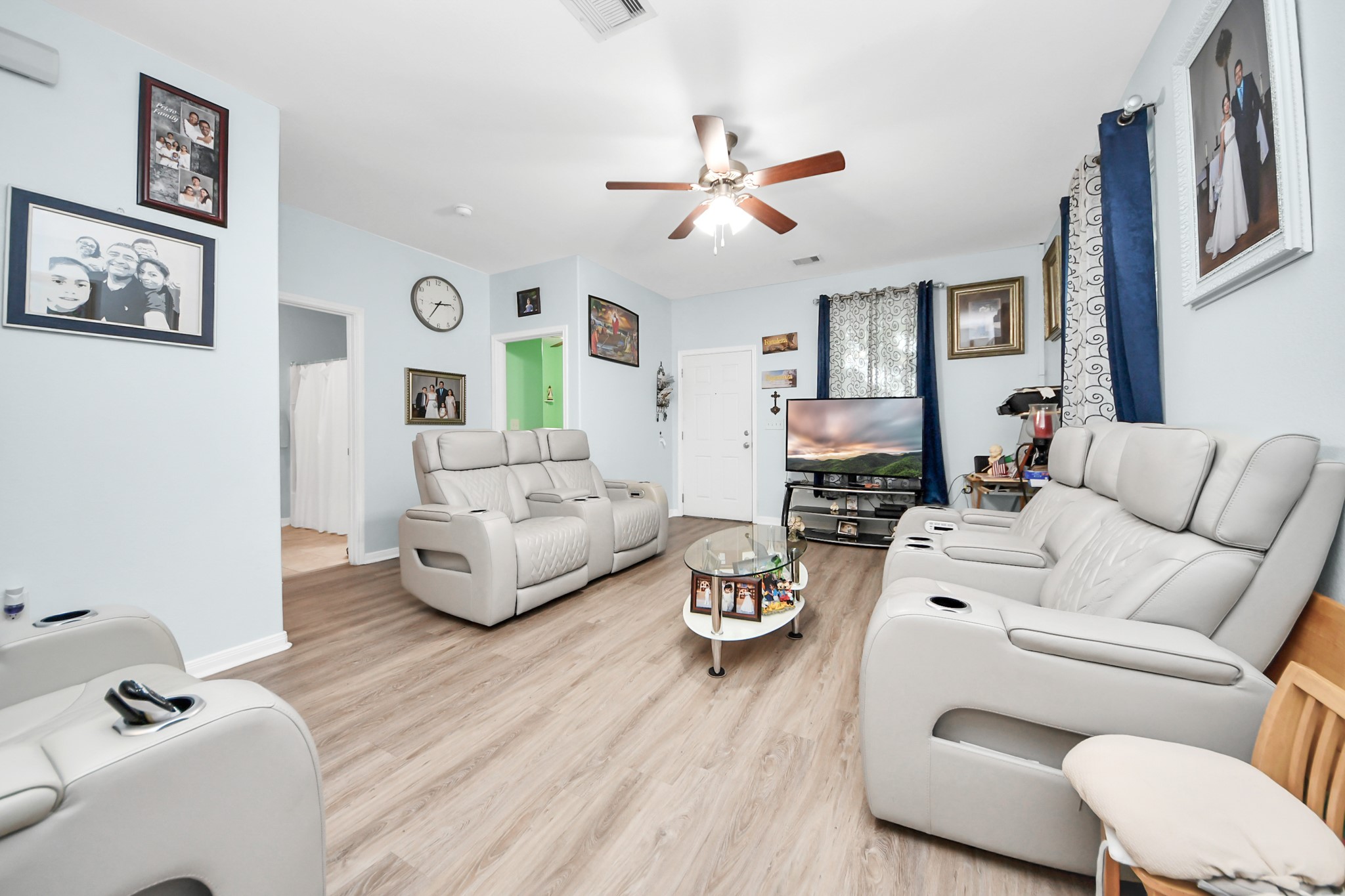 5319 Avenue R Galveston, TX 77551 - Photo 4 of 20 a living room with furniture and a wooden floor