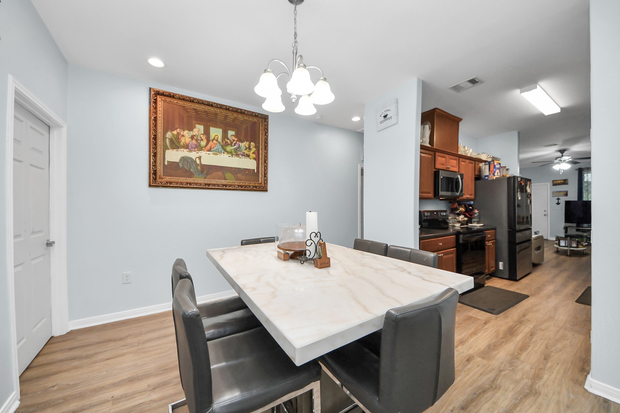 5319 Avenue R Galveston, TX 77551 - Photo 7 of 20 a view of a dining room with furniture and wooden floor