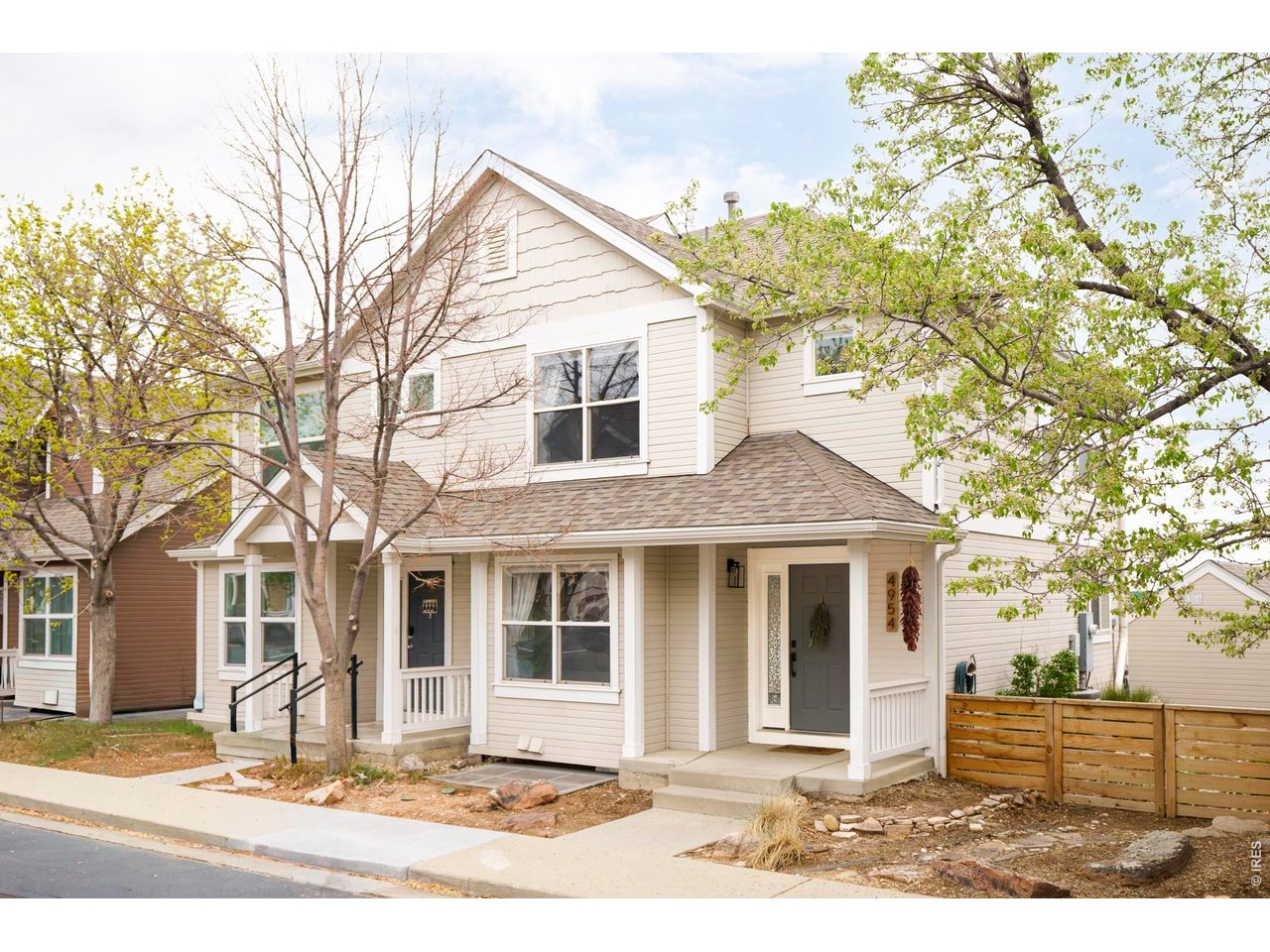 4954 10th Street Boulder, CO 80304 - Photo 1 of 21 a front view of a house with a yard