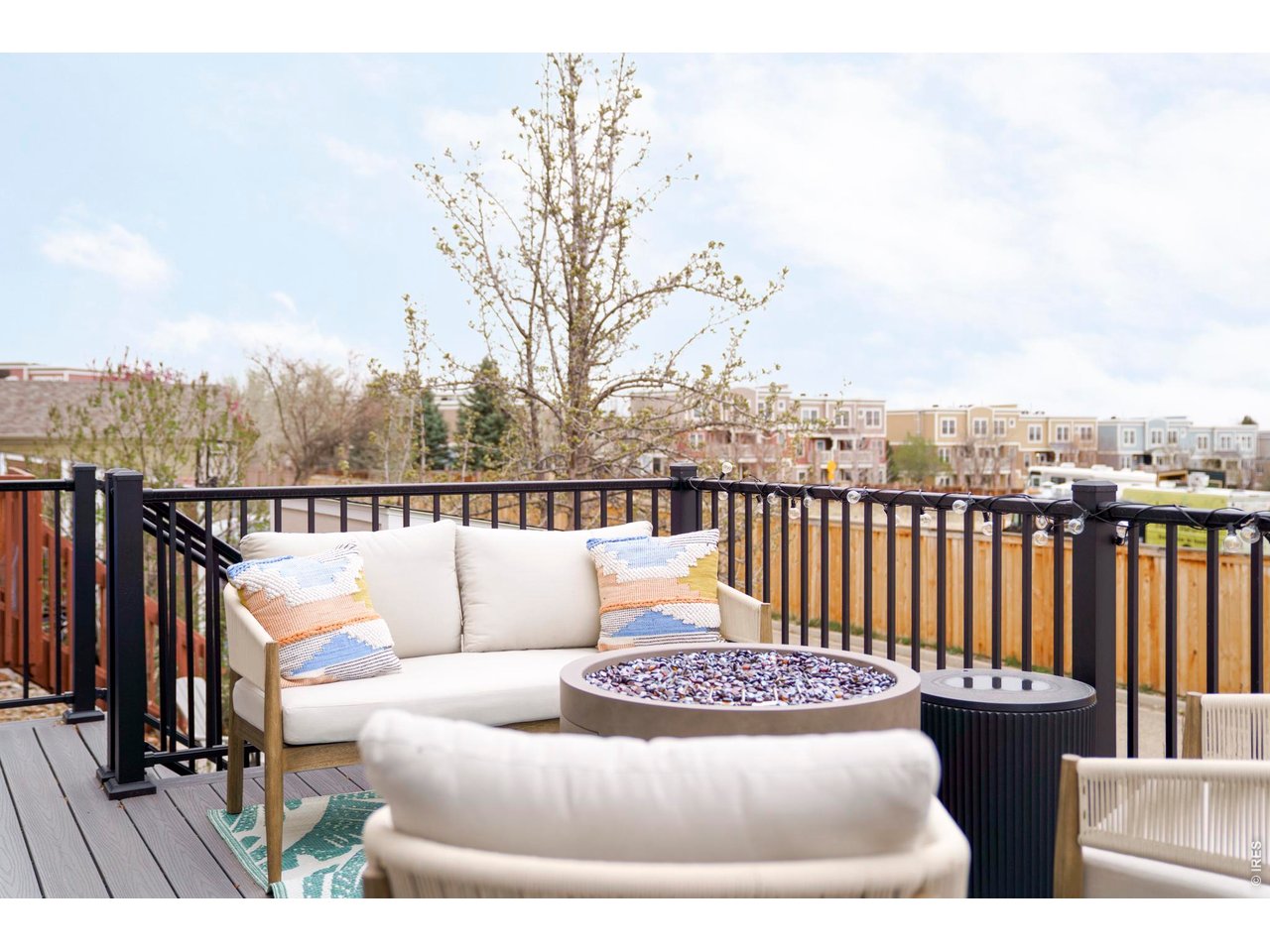 4954 10th Street Boulder, CO 80304 - Photo 4 of 21 a view of a roof deck with couches and wooden floor