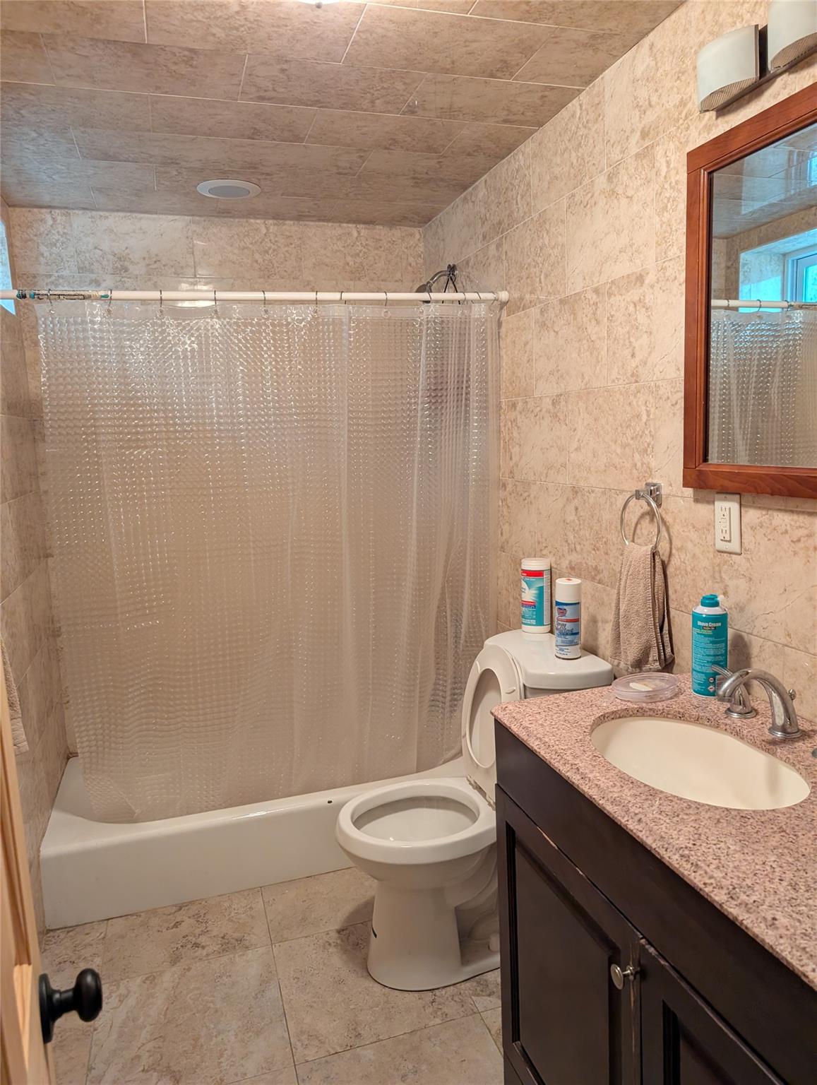 15 Lenzie Street Staten Island, NY 10312 - Photo 12 of 19 a bathroom with a granite countertop bathtub sink vanity mirror and toilet