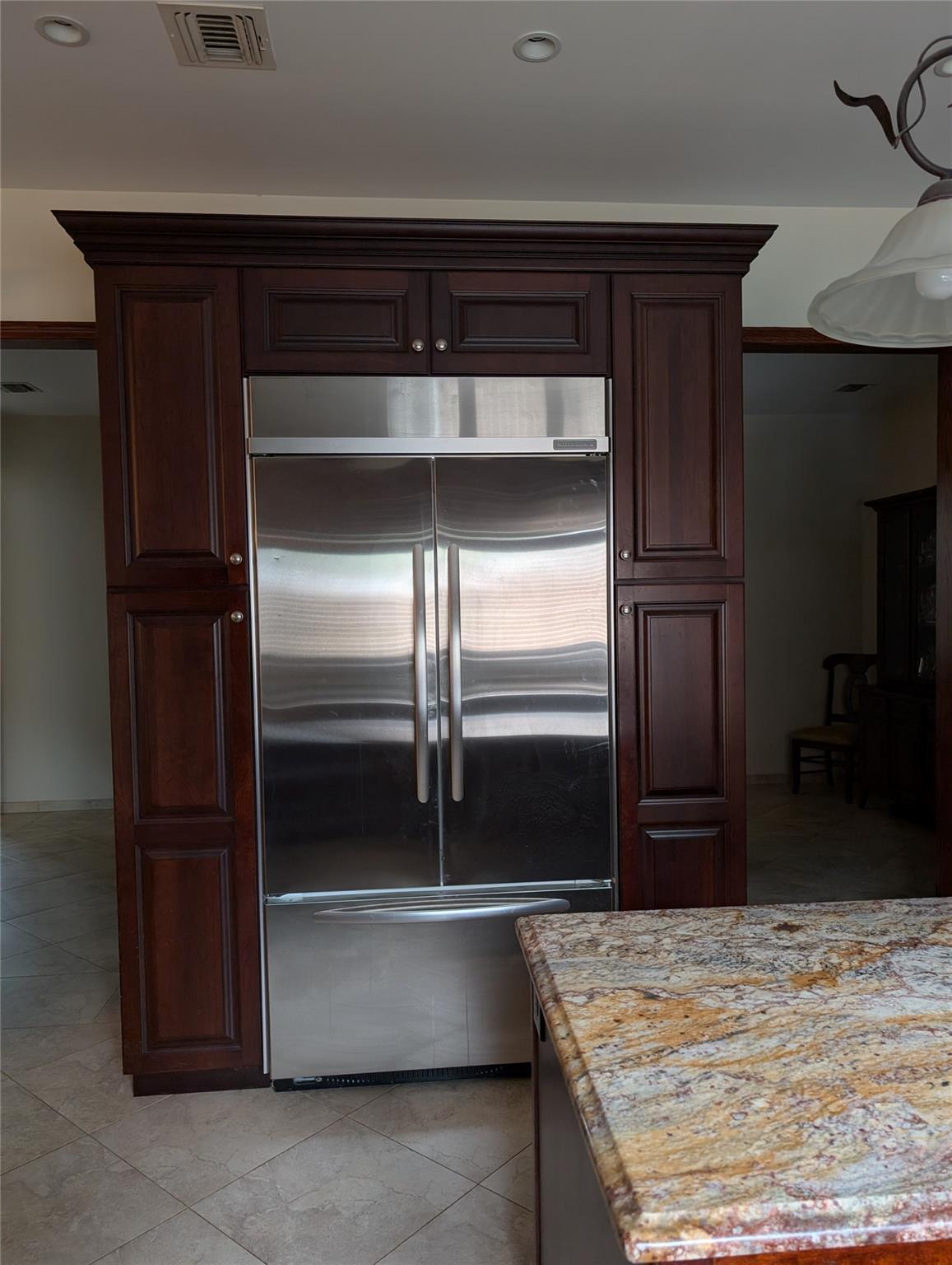 15 Lenzie Street Staten Island, NY 10312 - Photo 6 of 19 a kitchen with kitchen island granite countertop stainless steel appliances and a refrigerator