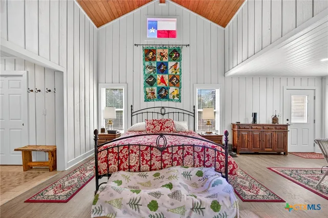 a bedroom with a bed and a couch