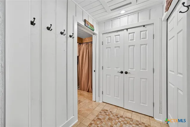 a view of a room that has a table and chairs