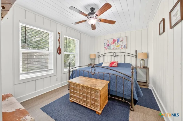 a bathroom with a toilet and a view of bathroom