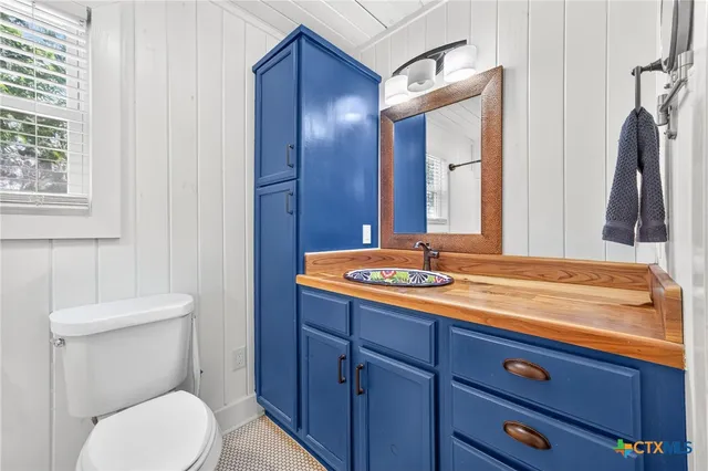 a bedroom with furniture and windows