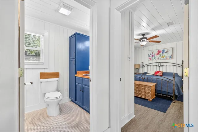 a bed room with furniture and window