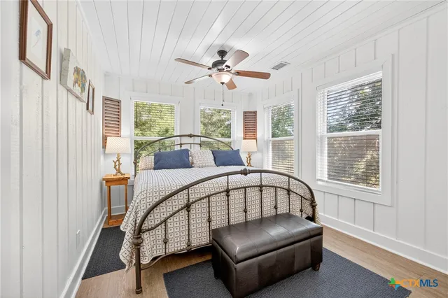 a view of balcony with floor to ceiling window wooden floor and outdoor seating