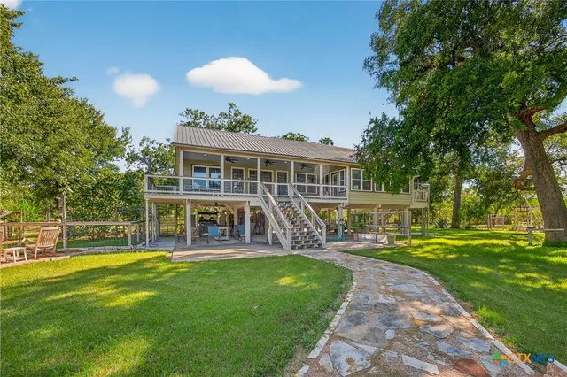 a view of a yard with an outdoor space