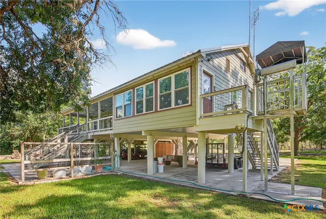 aerial view of a house with a yard table and chairs