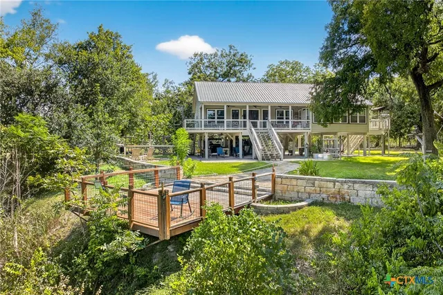 a view of a park with large trees