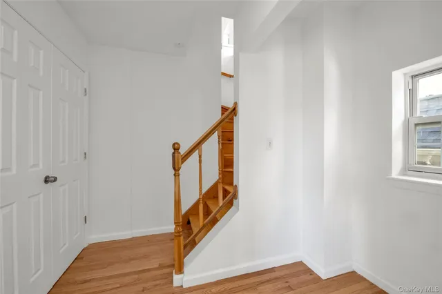 a view of an entryway with wooden floor