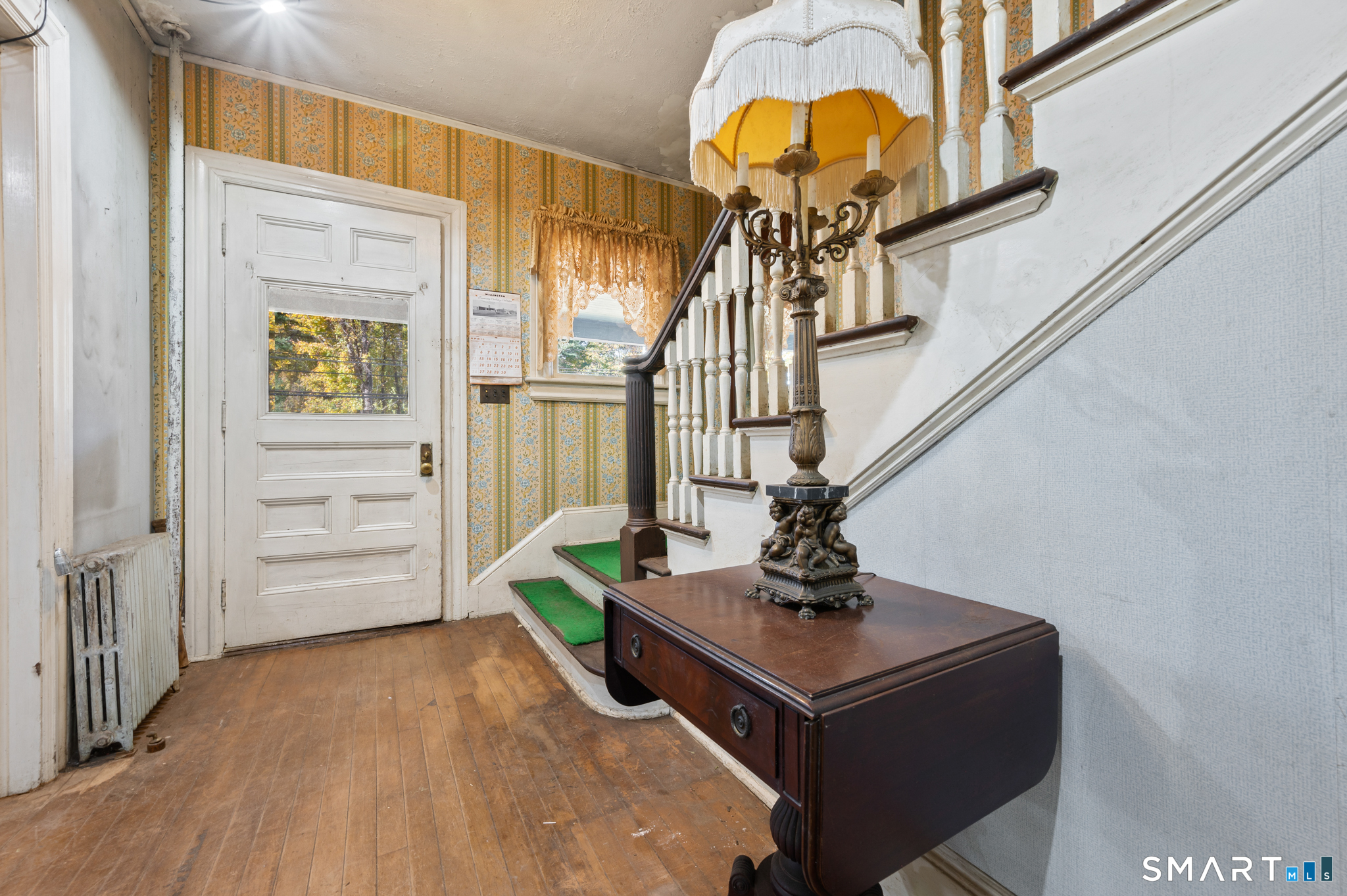 124 River Road Willington, CT 06279 - Photo 20 of 40 a living room with furniture and a wooden floor
