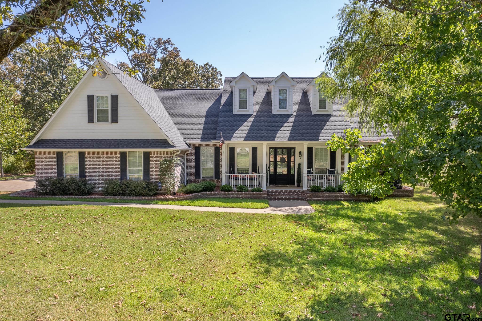 a front view of a house with swimming pool