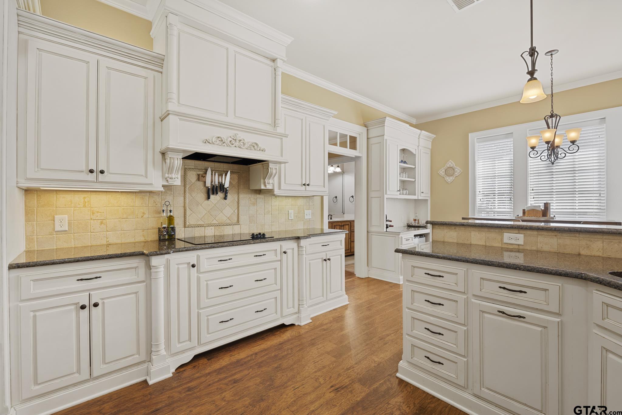 19950 Post Oak Bend Lindale, TX 75771 - Photo 11 of 42 a kitchen with white cabinets and sink