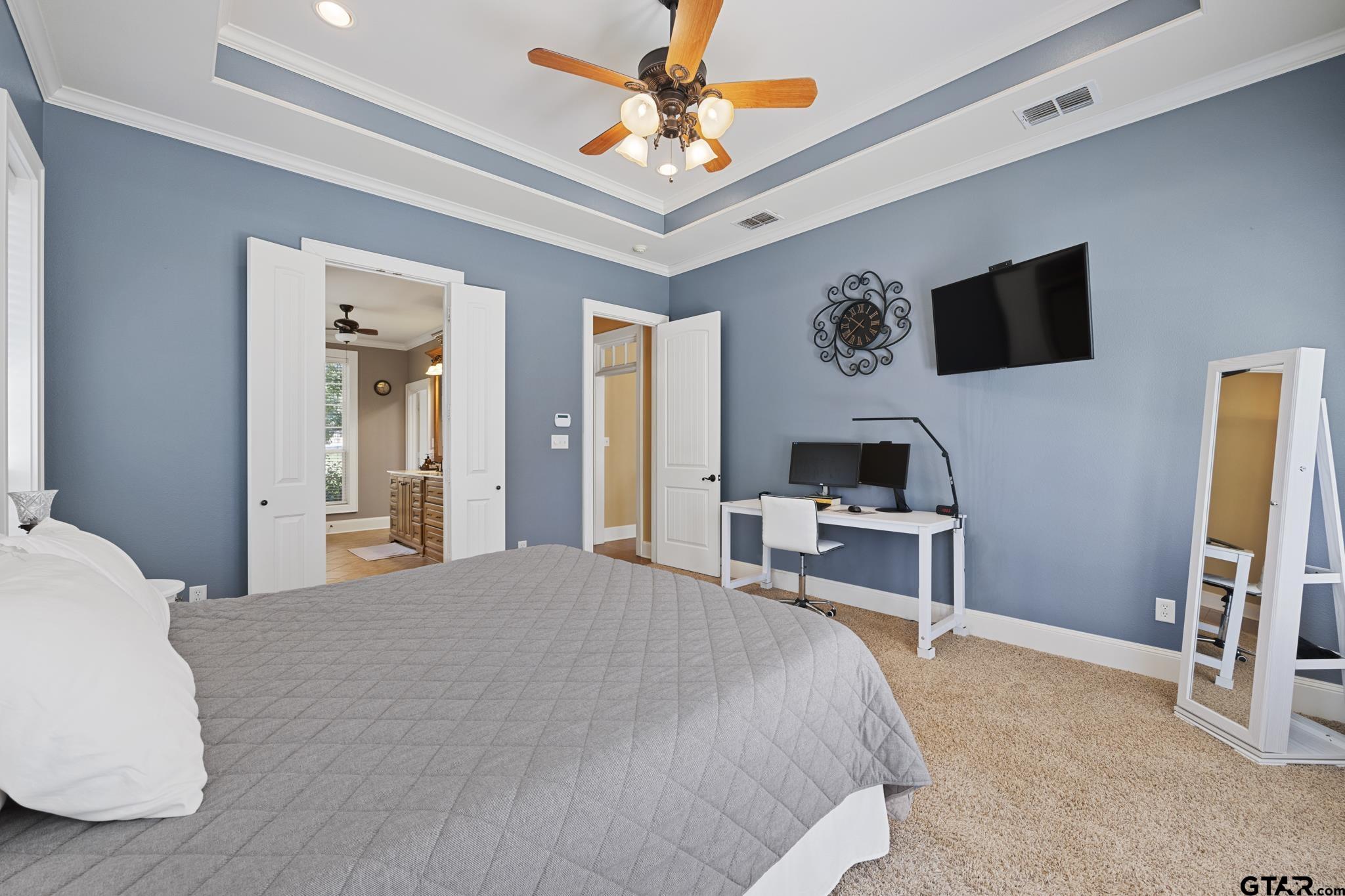19950 Post Oak Bend Lindale, TX 75771 - Photo 23 of 42 a bedroom with a bed and a flat screen tv