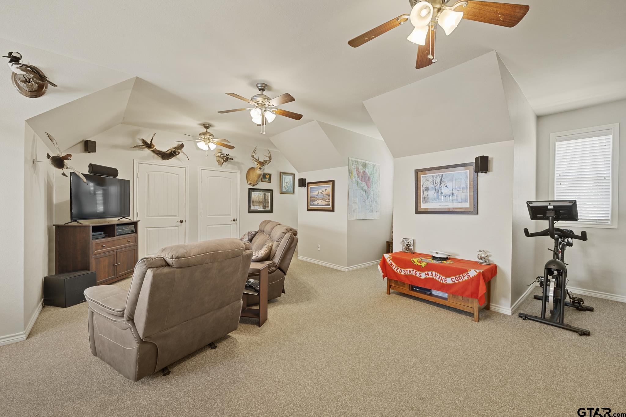 19950 Post Oak Bend Lindale, TX 75771 - Photo 31 of 42 a living room with furniture and a chandelier