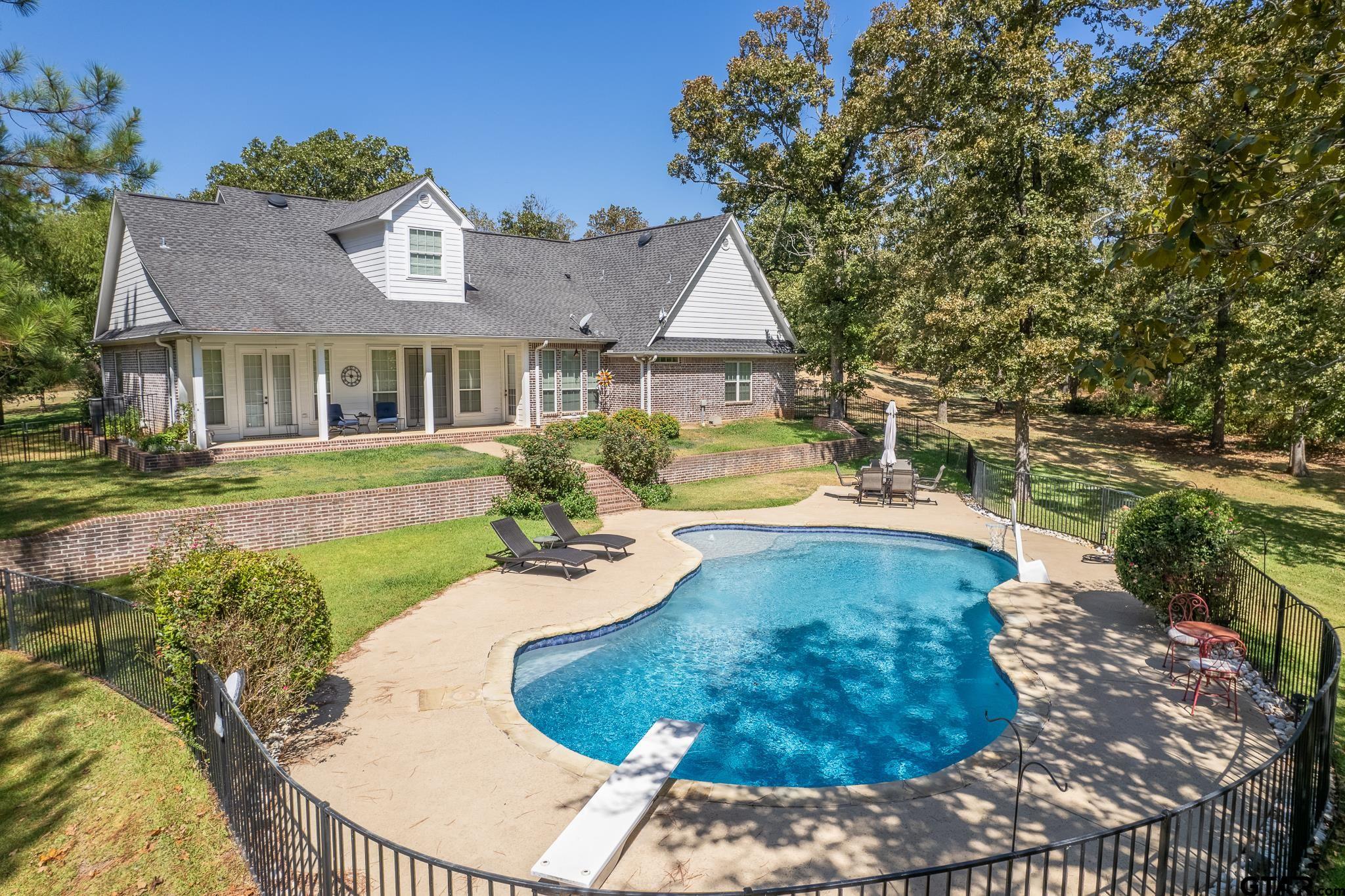 19950 Post Oak Bend Lindale, TX 75771 - Photo 35 of 42 a view of a house with a swimming pool