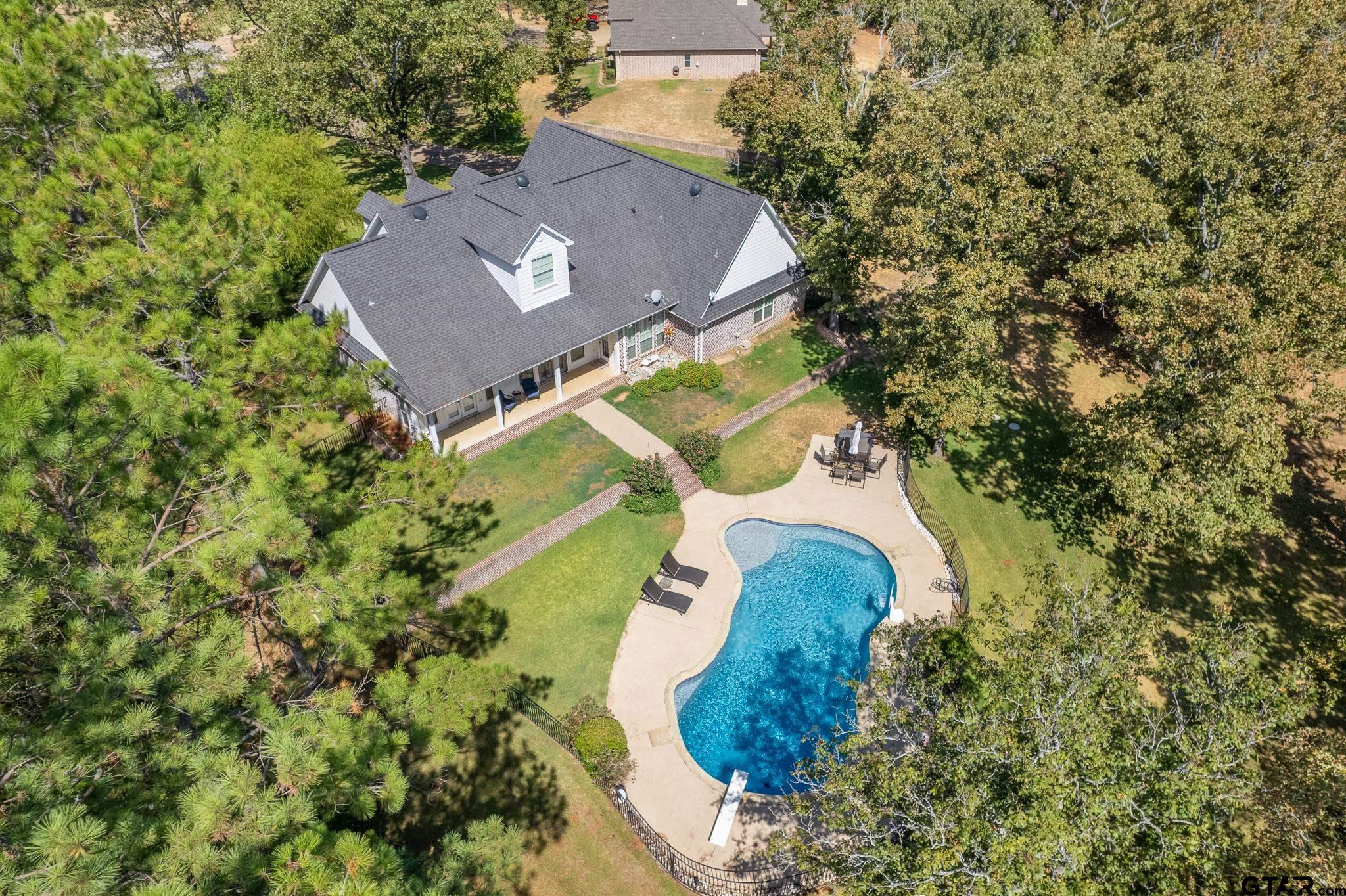 19950 Post Oak Bend Lindale, TX 75771 - Photo 42 of 42 an aerial view of a house with a yard and trees