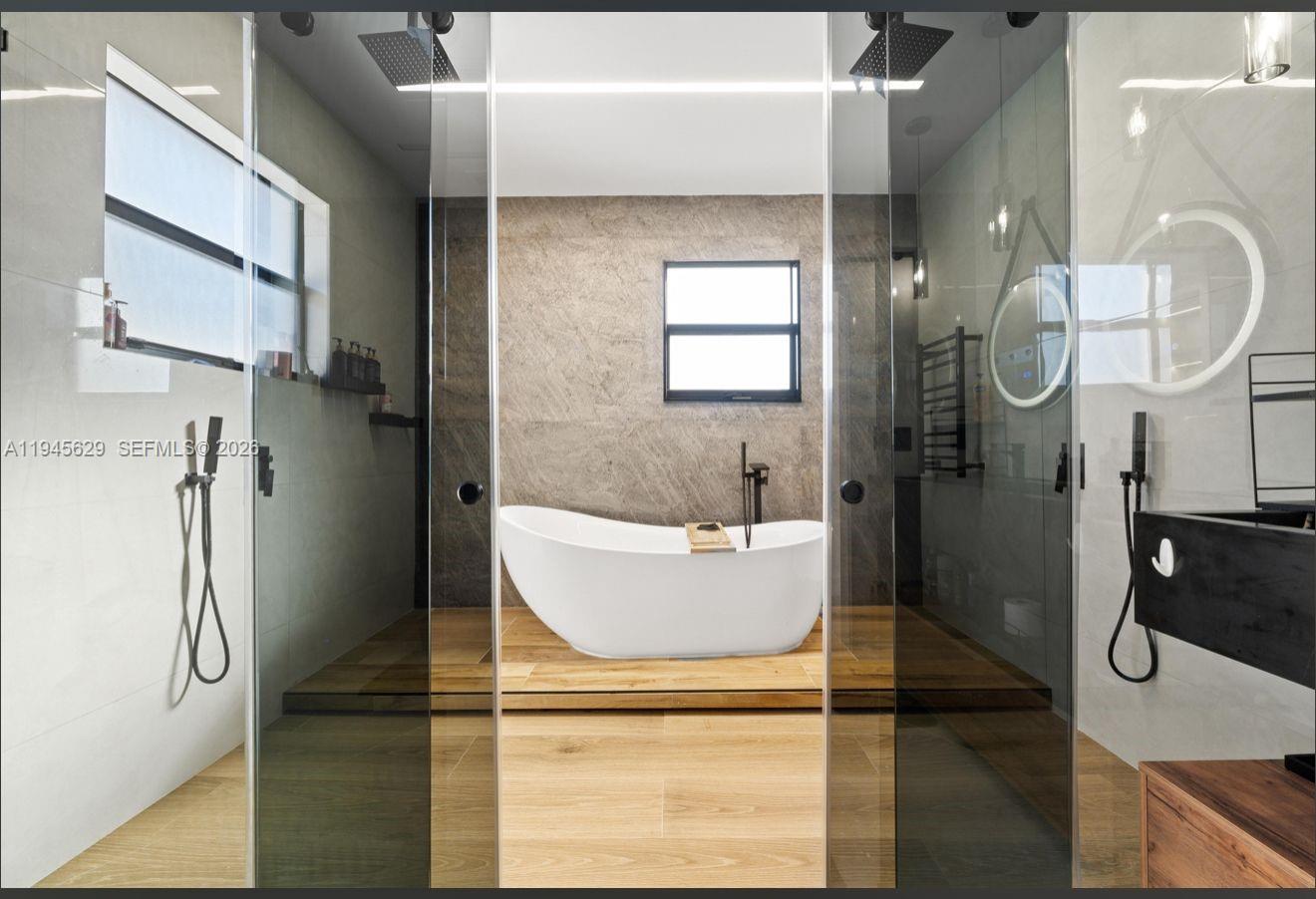 4499 Southwest 173rd Avenue Miramar, FL 33029 - Photo 3 of 11 a bathroom with a bathtub and shower