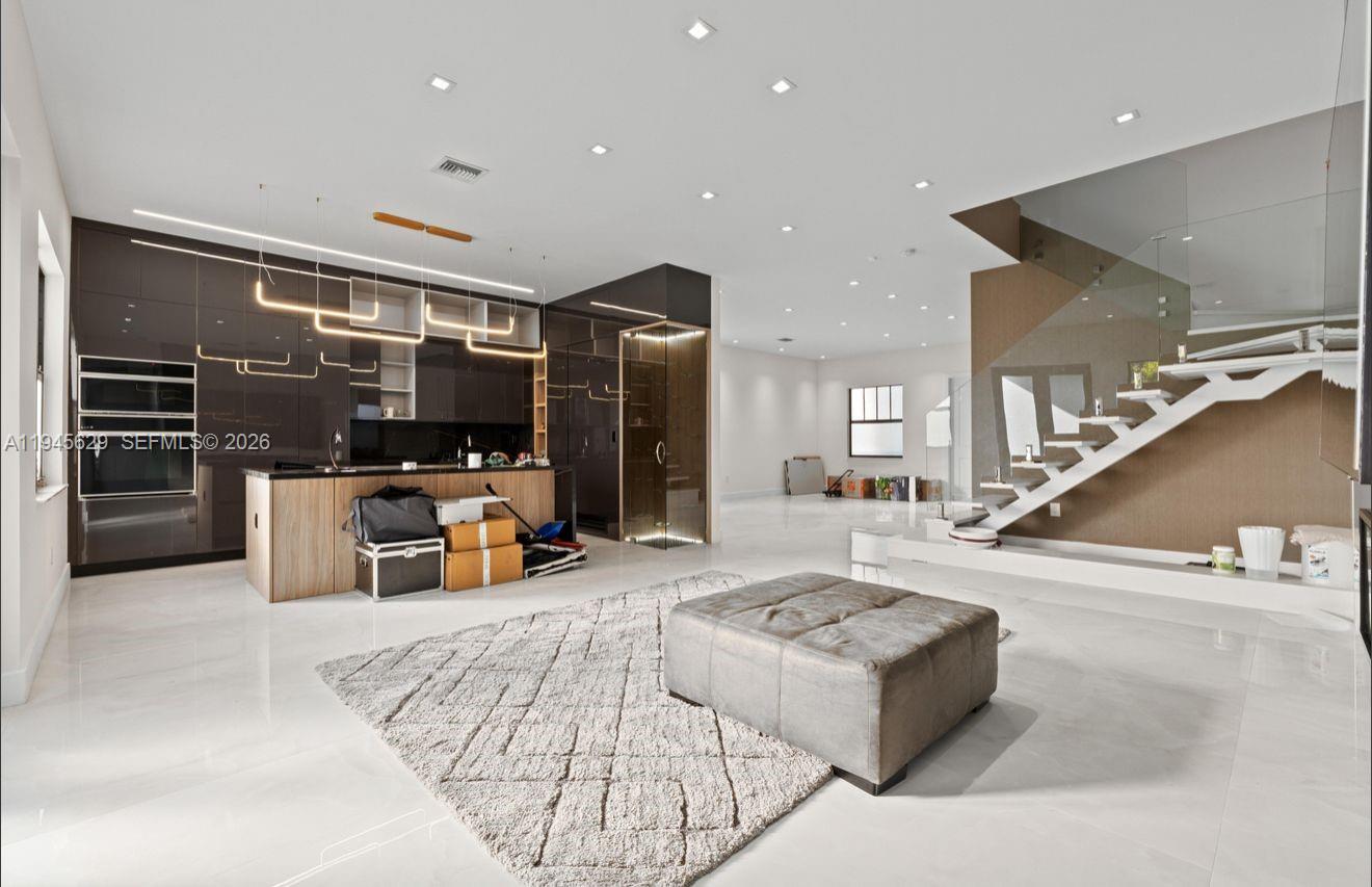 4499 Southwest 173rd Avenue Miramar, FL 33029 - Photo 5 of 11 a living room with furniture and flat screen tv