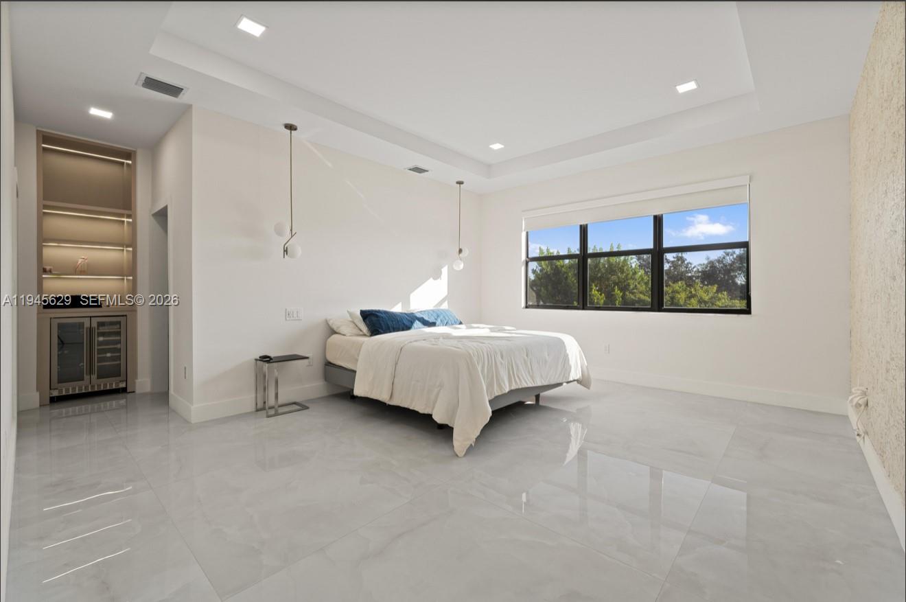 4499 Southwest 173rd Avenue Miramar, FL 33029 - Photo 10 of 11 a bedroom with a bed and a view of kitchen