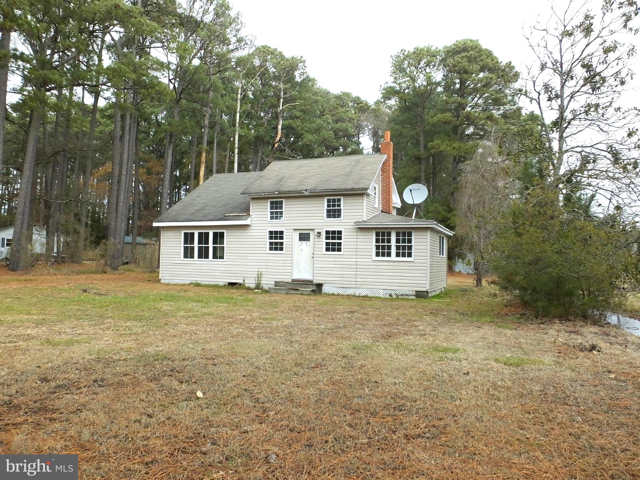 2530 Toddville Road Toddville, MD 21672 - Photo 4 of 24 a front view of a house with a garden