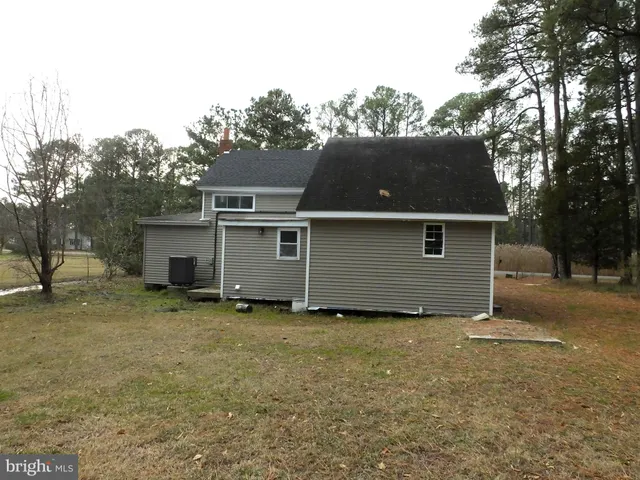 a swimming pool with trees in the background
