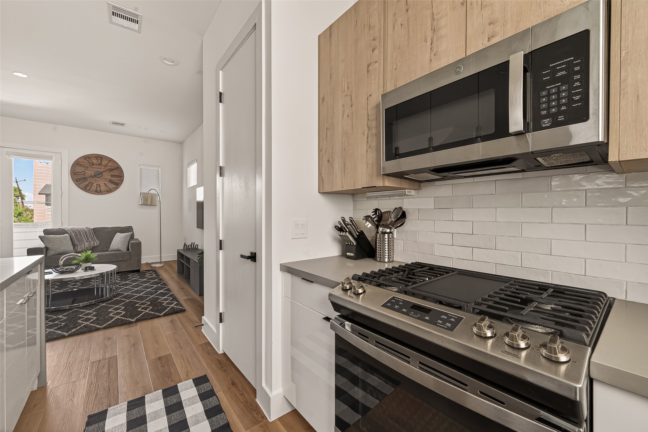 3402 Luca Street Houston, TX 77021 - Photo 11 of 36 a kitchen with a stove and a microwave