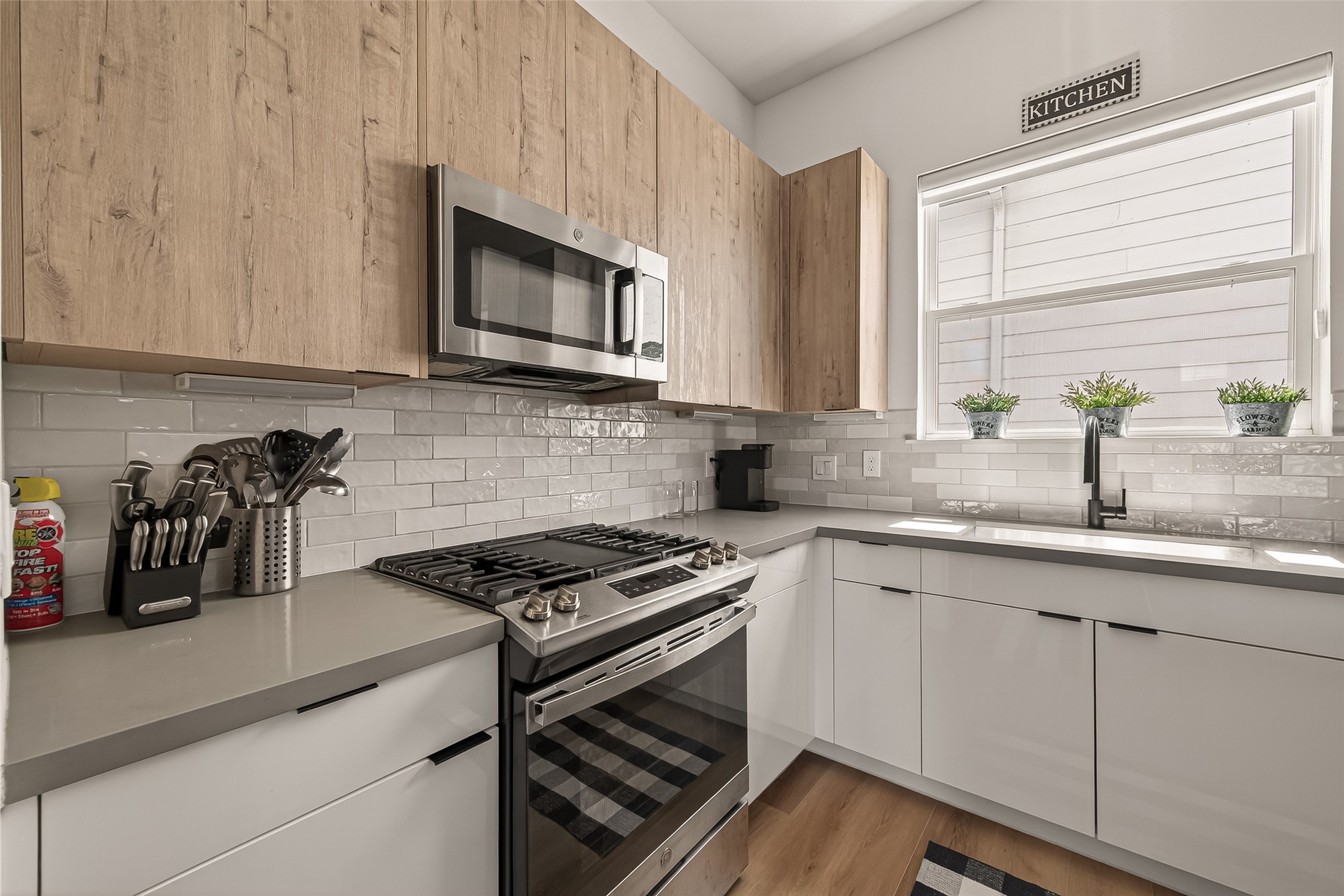 3402 Luca Street Houston, TX 77021 - Photo 13 of 36 a kitchen with granite countertop a sink and a stove top oven