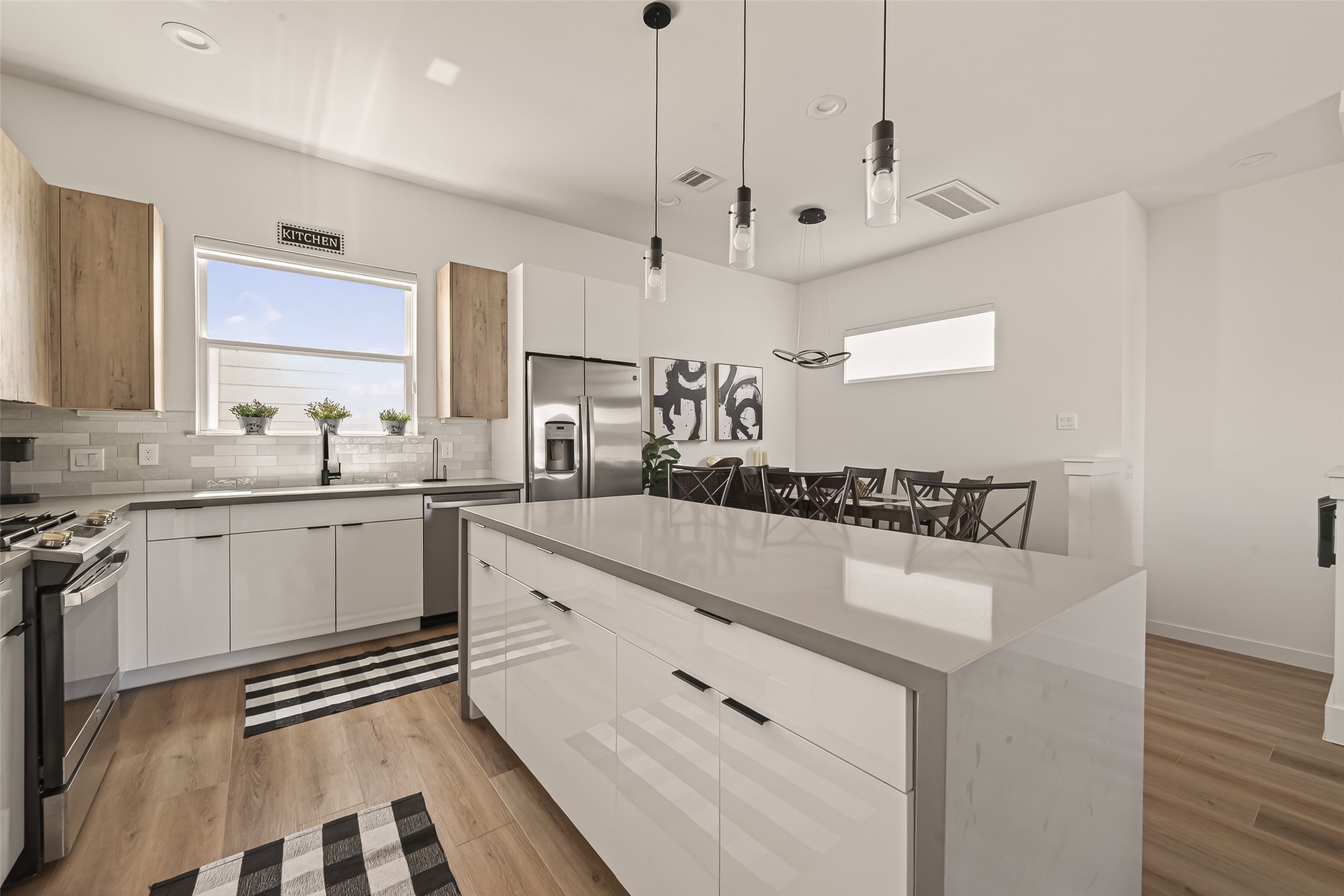 3402 Luca Street Houston, TX 77021 - Photo 14 of 36 a very nice looking kitchen with granite countertop a sink a stove a dining table and chairs
