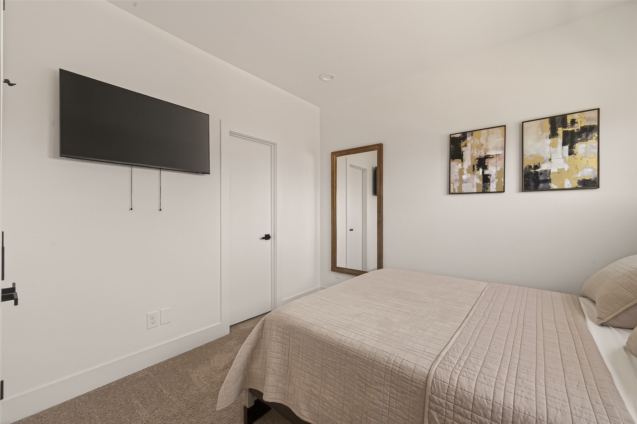 3402 Luca Street Houston, TX 77021 - Photo 18 of 36 a bedroom with a bed and a flat screen tv