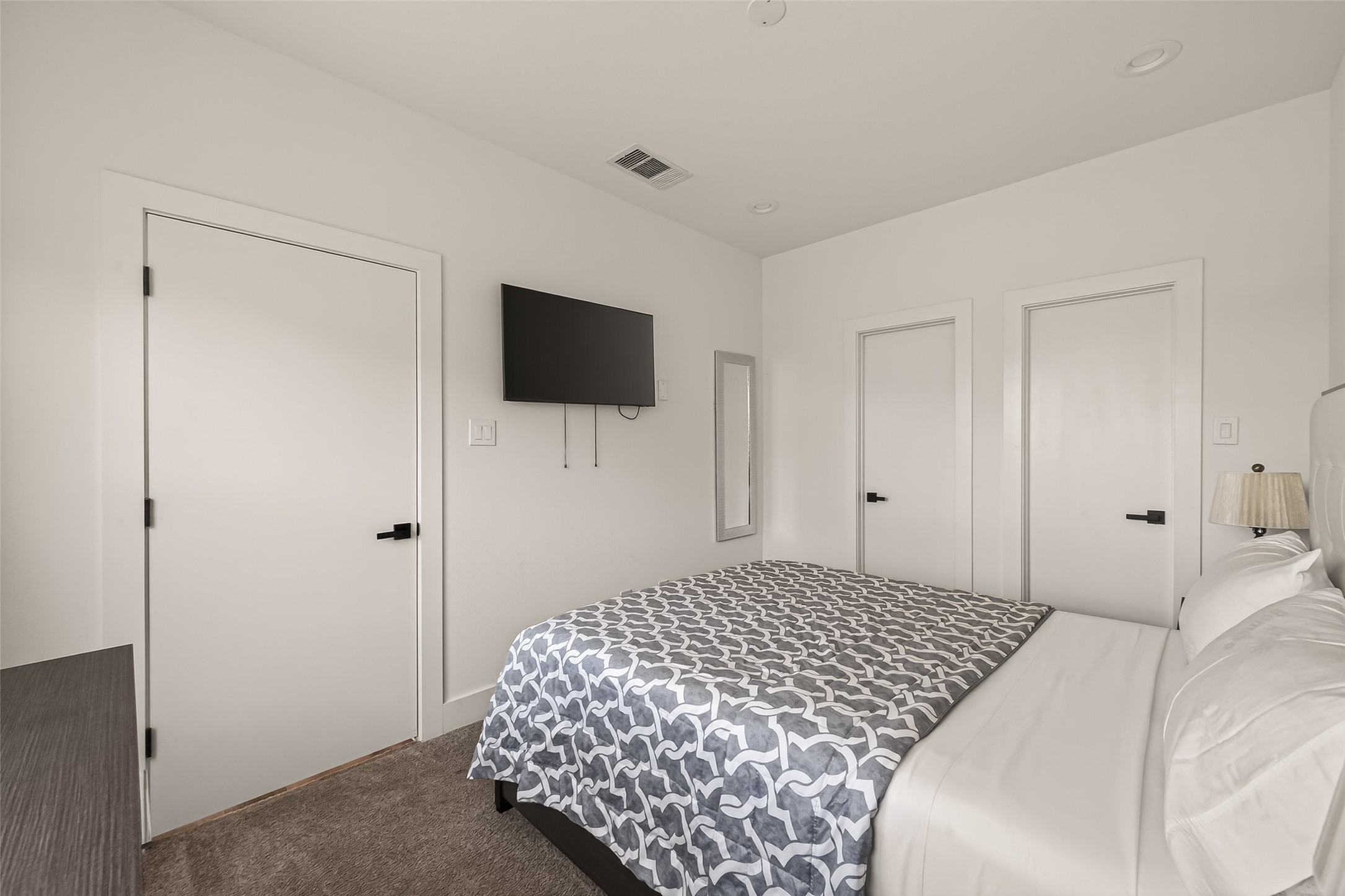 3402 Luca Street Houston, TX 77021 - Photo 22 of 36 a bedroom with a bed and a flat screen tv