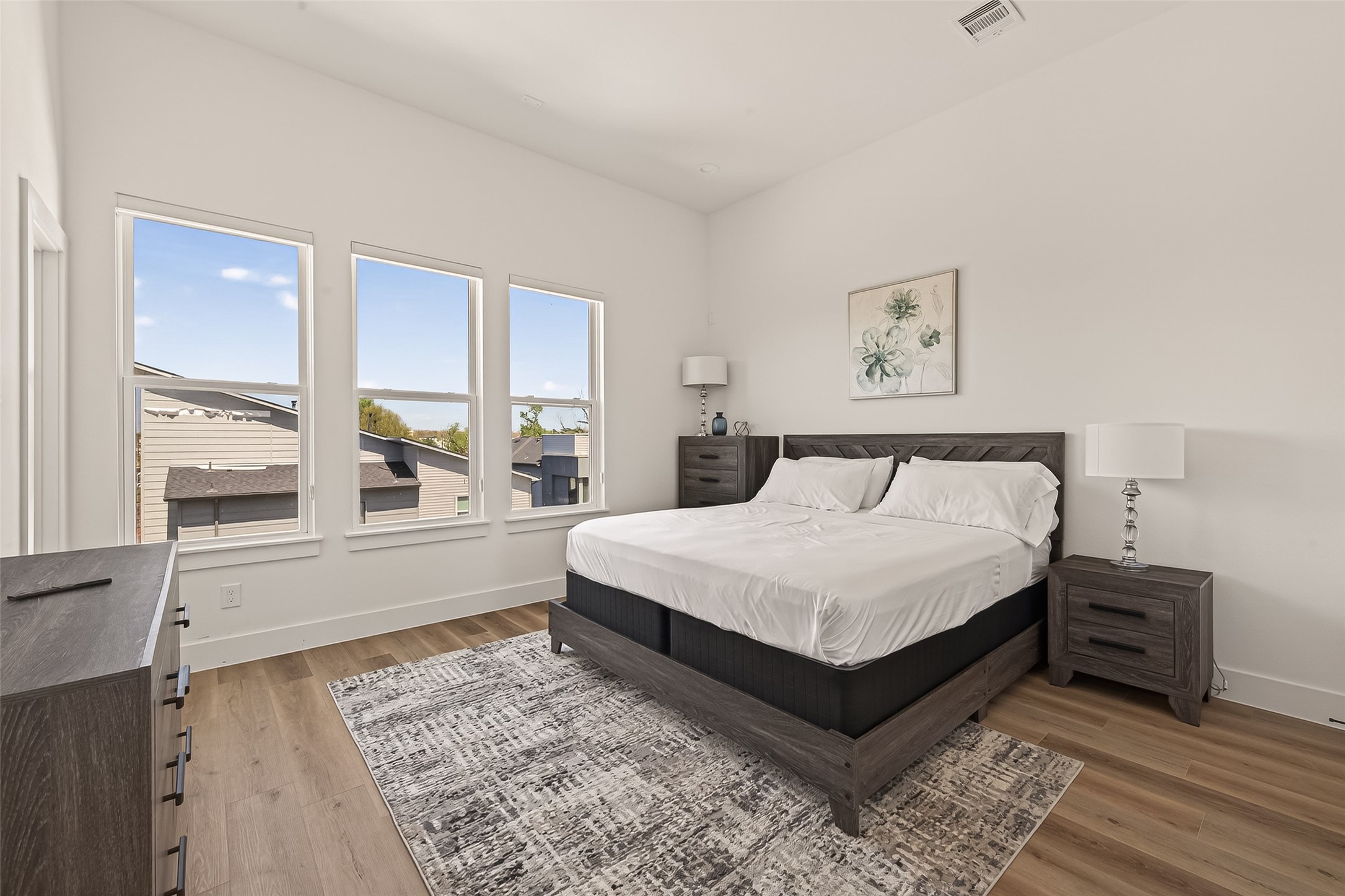 3402 Luca Street Houston, TX 77021 - Photo 24 of 36 a large bed sitting in a bedroom next to a window