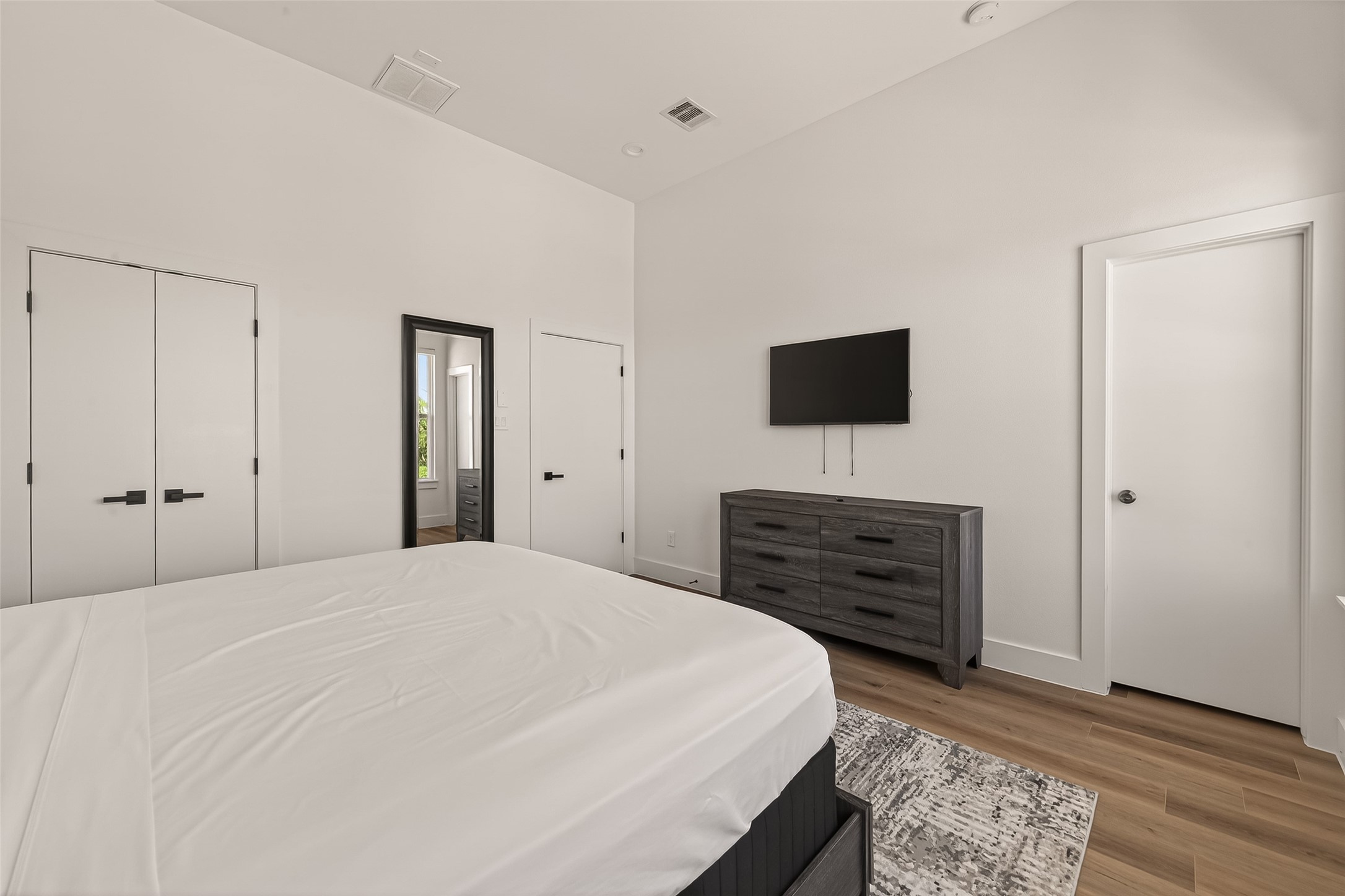 3402 Luca Street Houston, TX 77021 - Photo 26 of 36 a bedroom with a bed and a flat screen tv