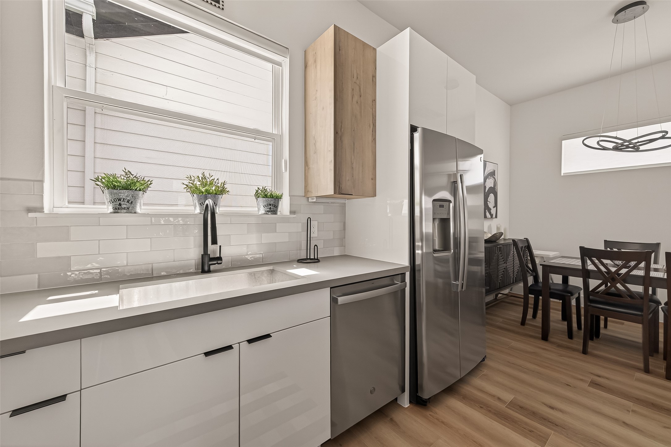 3402 Luca Street Houston, TX 77021 - Photo 10 of 36 a kitchen with stainless steel appliances granite countertop a sink and a refrigerator