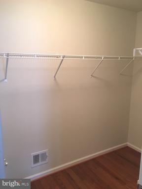 9650 Pullman Place Fairfax, VA 22031 - Photo 11 of 14 a view of a room with racks on the wall