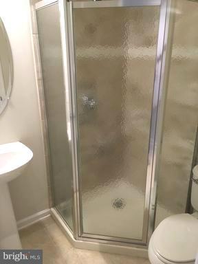 9650 Pullman Place Fairfax, VA 22031 - Photo 13 of 14 a bathroom with a glass shower door