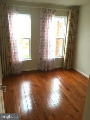 9650 Pullman Place Fairfax, VA 22031 - Photo 10 of 14 a view of empty room with wooden floor and fan