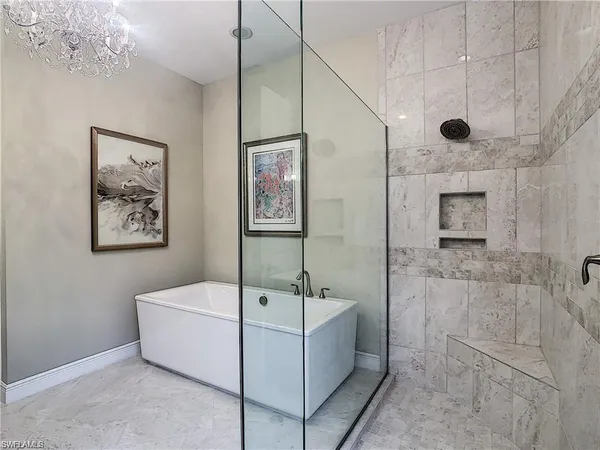 a bathroom with a sink a mirror and a shower