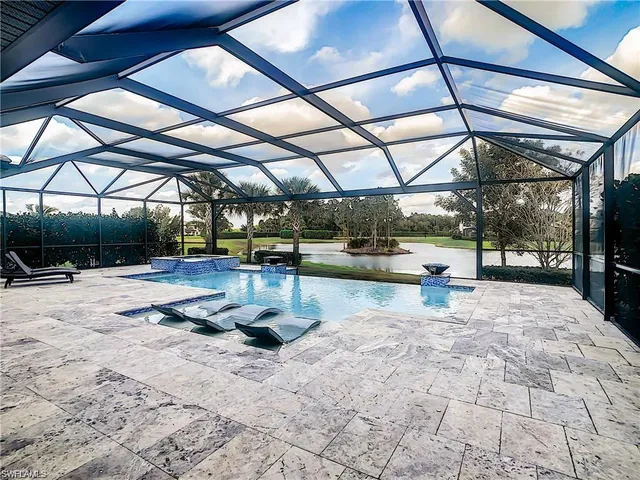 a view of a swimming pool with a patio