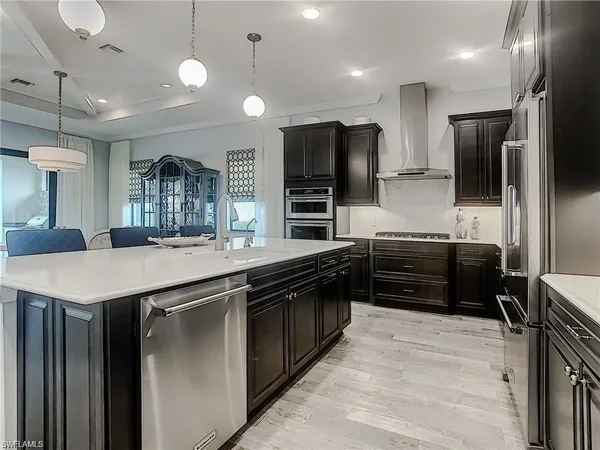 a kitchen with a refrigerator and a sink