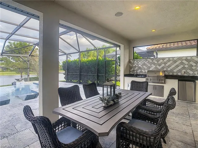 a view of a dining room with furniture wooden floor and a potted plant