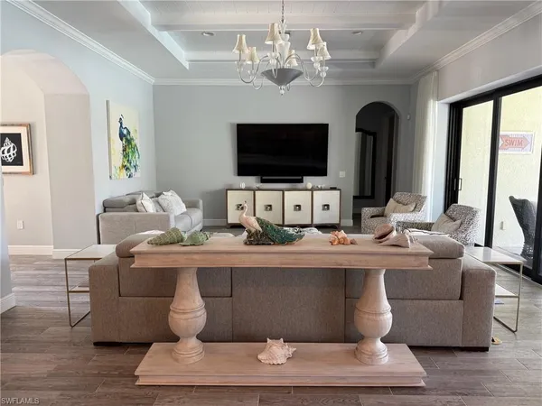 a living room with fireplace furniture and a flat screen tv